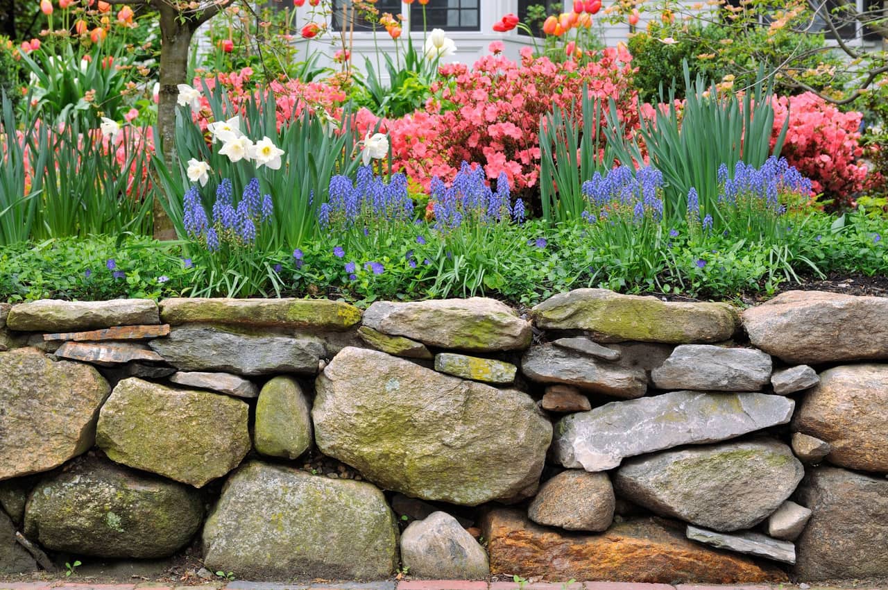 Custom retaining wall built with natural stone blocks