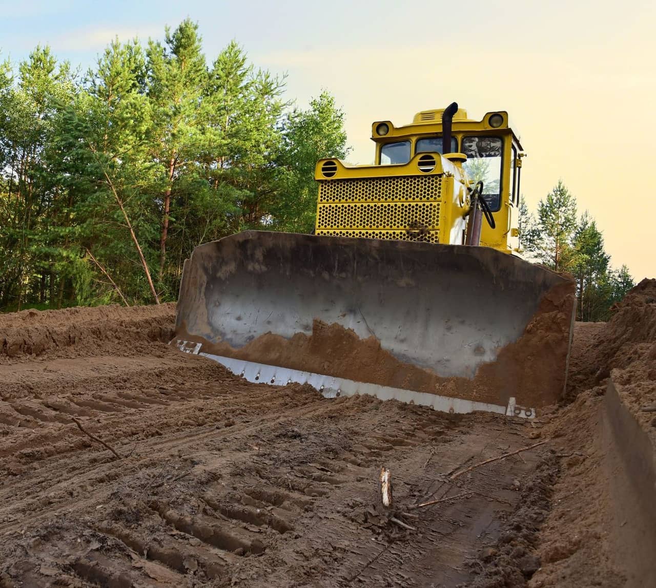 A bulldozer moving dirt on a construction site