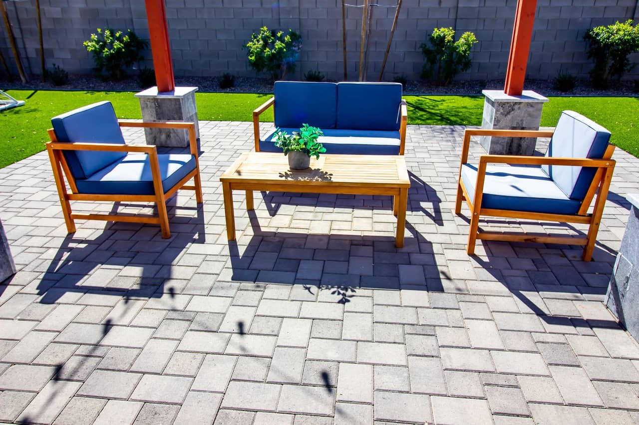 Paver patio installation with interlocking stone patterns