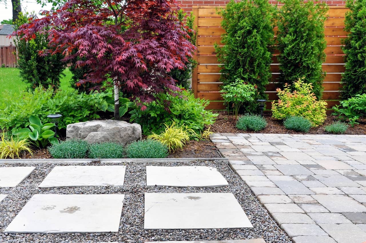 Custom stone walkway through a landscaped garden