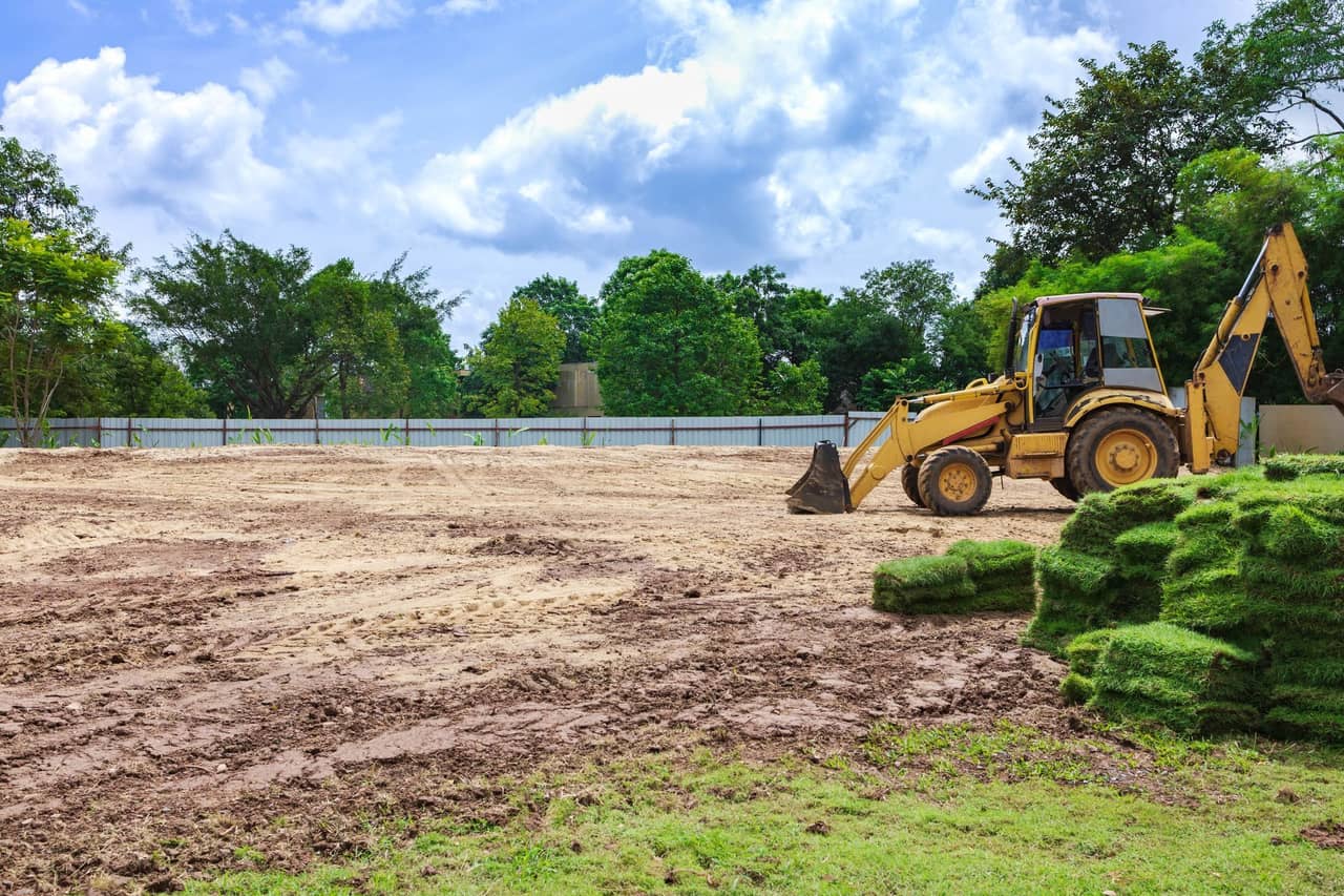 Residential property grading with heavy equipment
