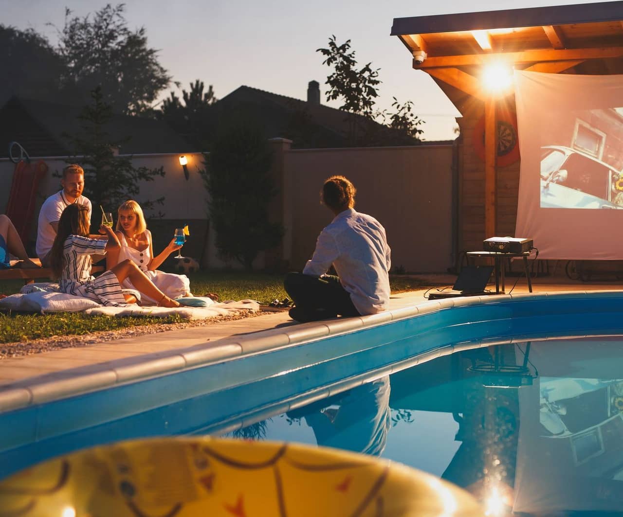 Family enjoying backyard pool