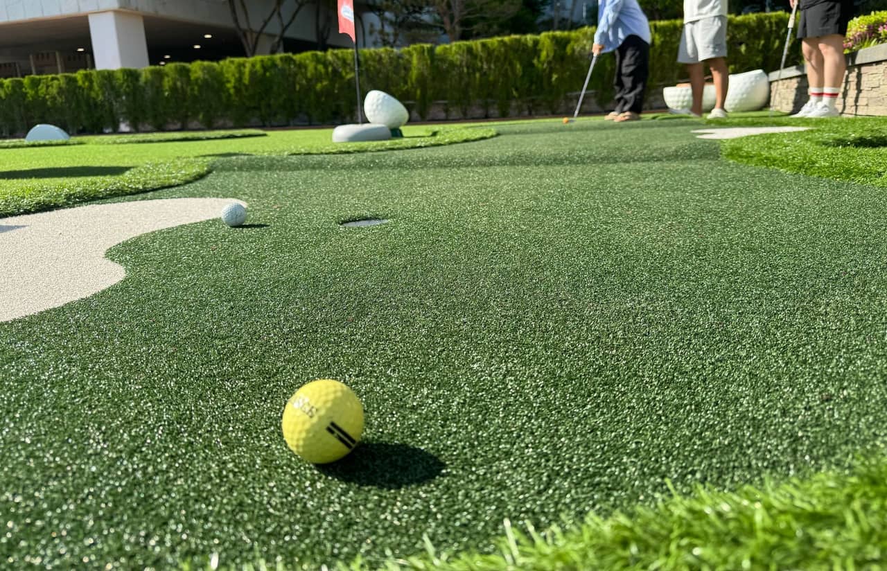 Workers installing artificial turf on a residential property